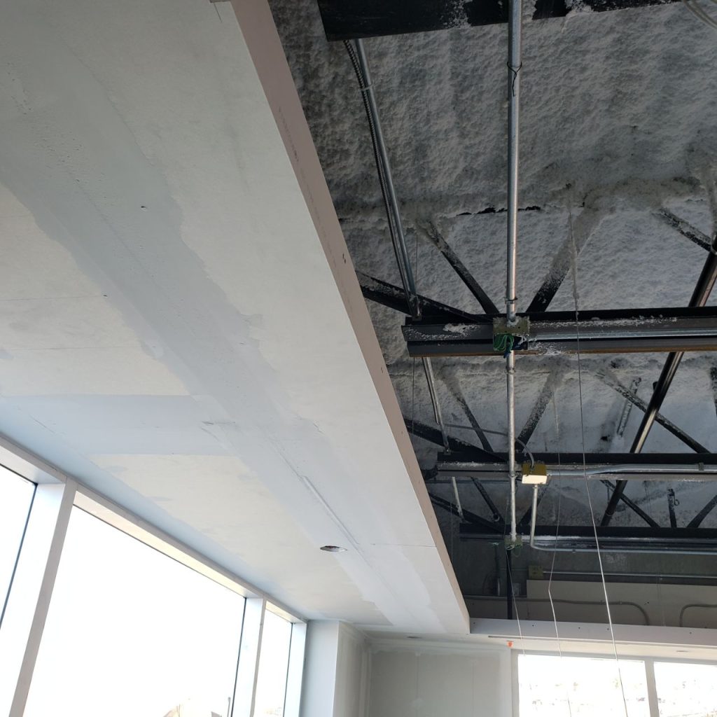 Bulkhead made from prefabricated drywall with unfinished ceiling