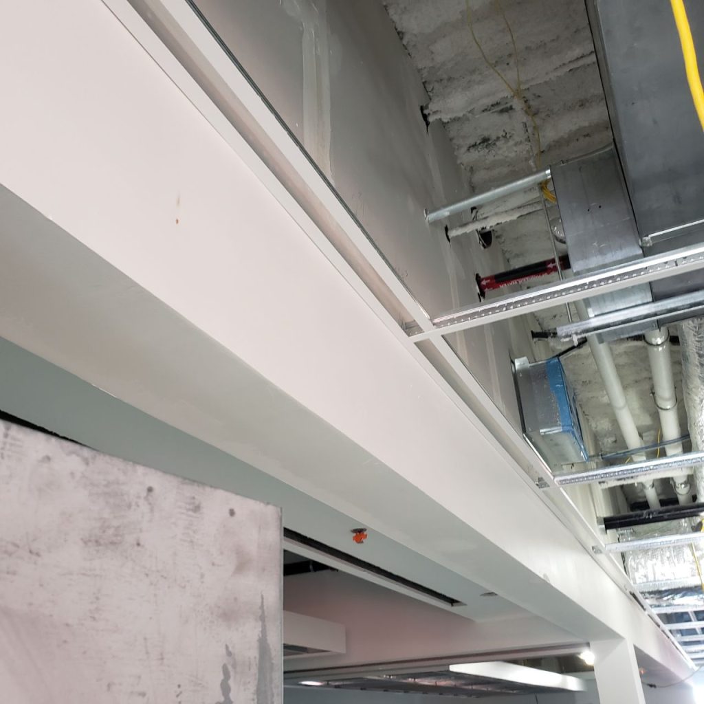 Ceiling return made from prefabricated drywall on an unfinished ceiling