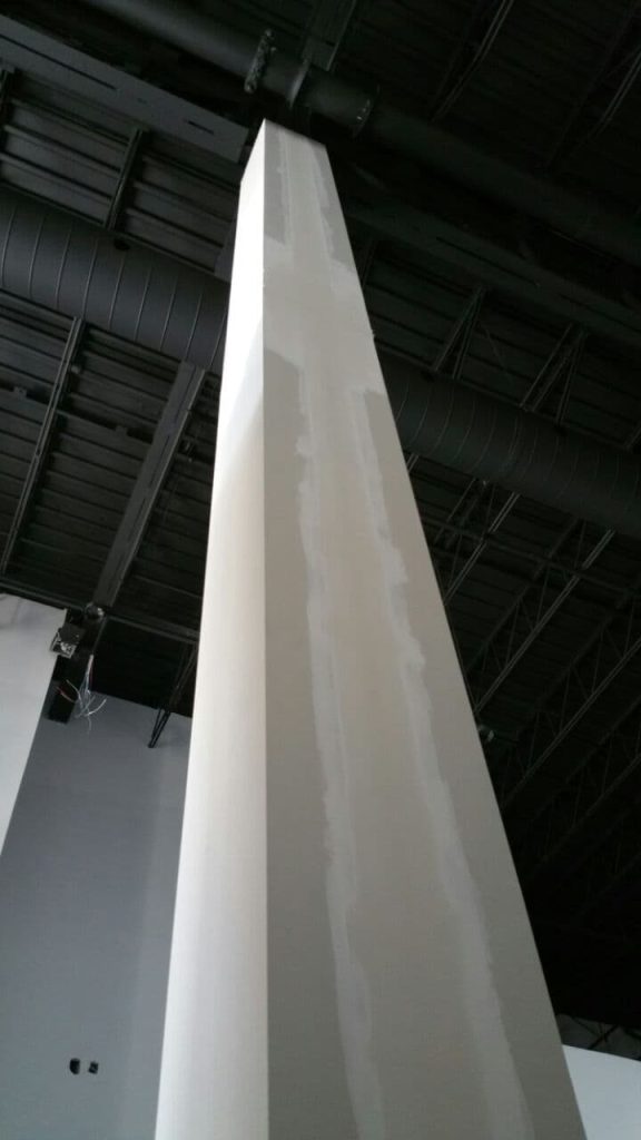 Column box made from prefabricated drywall with an exposed ceiling